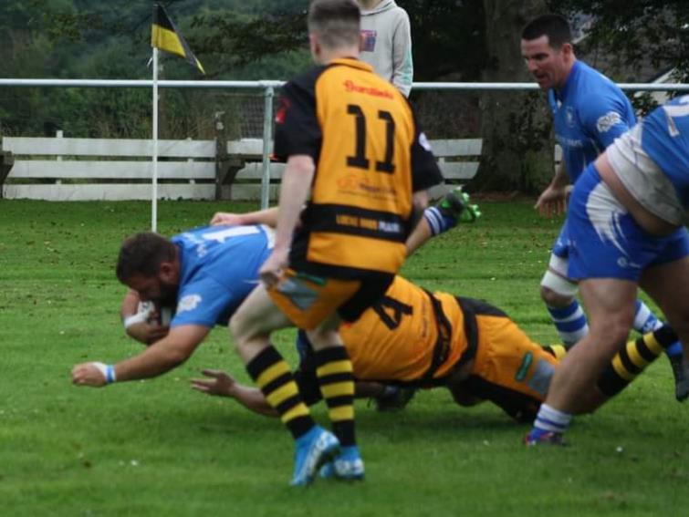 Jamie Zambass crashes over for a try for the Blues. Picture James Hemingray